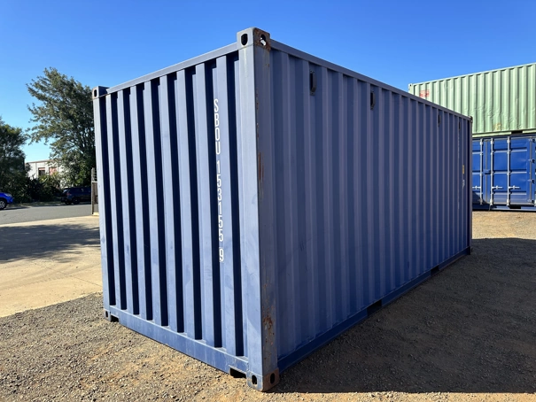 Back corner of a grade 7 20ft container, slightly rusted.