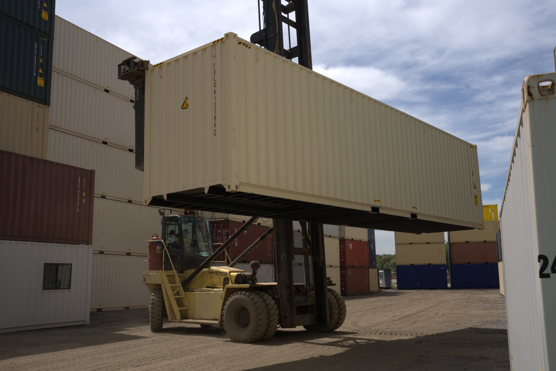 Forklift holding up a 40ft container